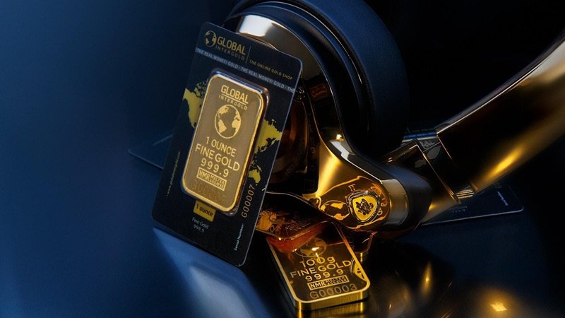 achievment-1 Photographic image depicting several stamped 1-ounce bars of fine gold