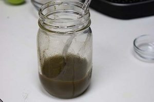 Kratom mixed with lemon juice resting on the counter