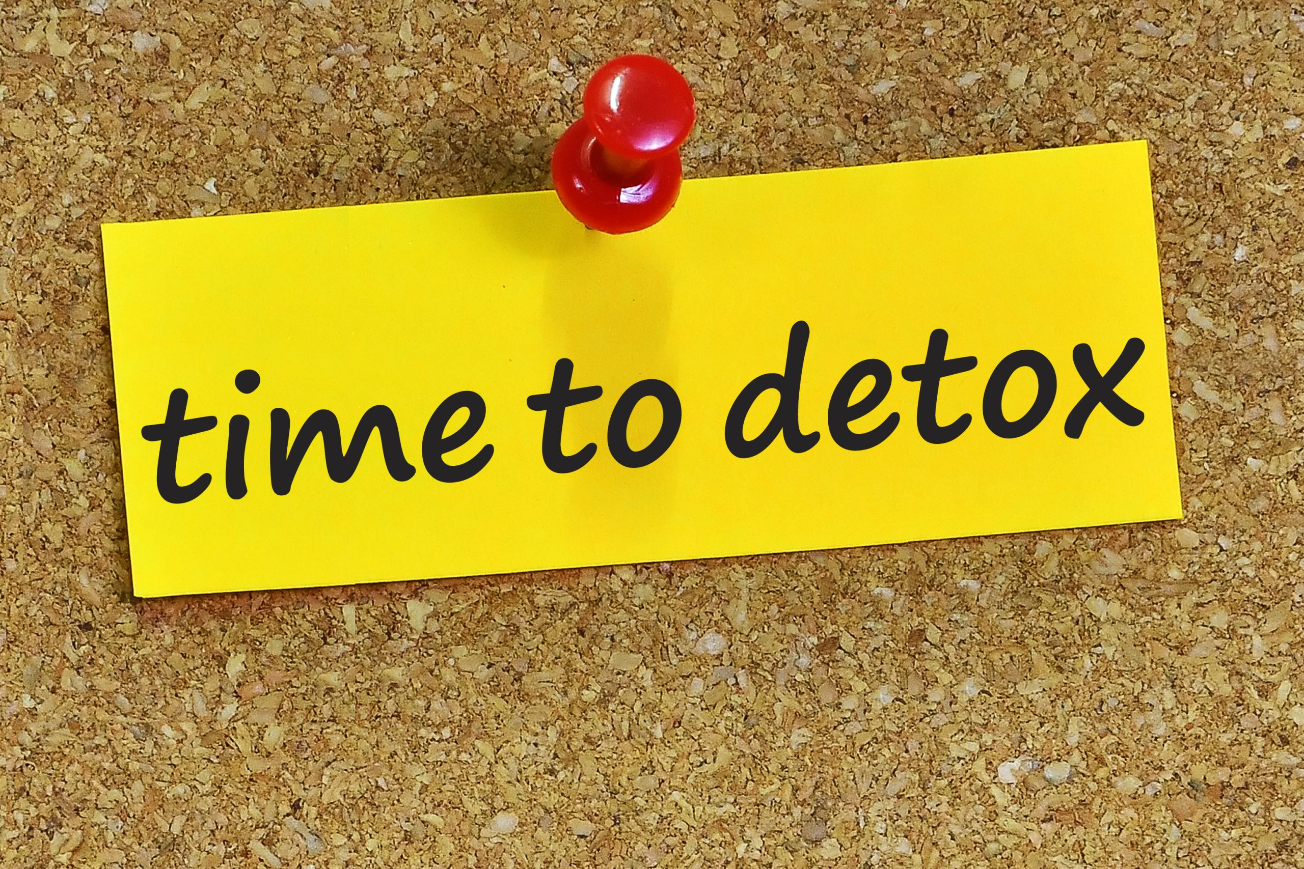 Featured image depicting a yellow scrap of paper pinned to a cork board backing. The scrap of paper reads "Time to Detox"