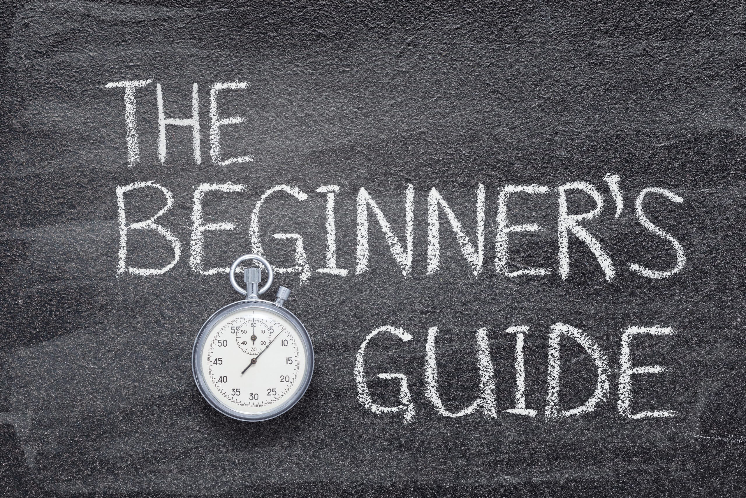 Featured Image depicting a chalkboard that says "Kratom Beginner's Guide"; A Pocketwatch sits on the chalkboard.