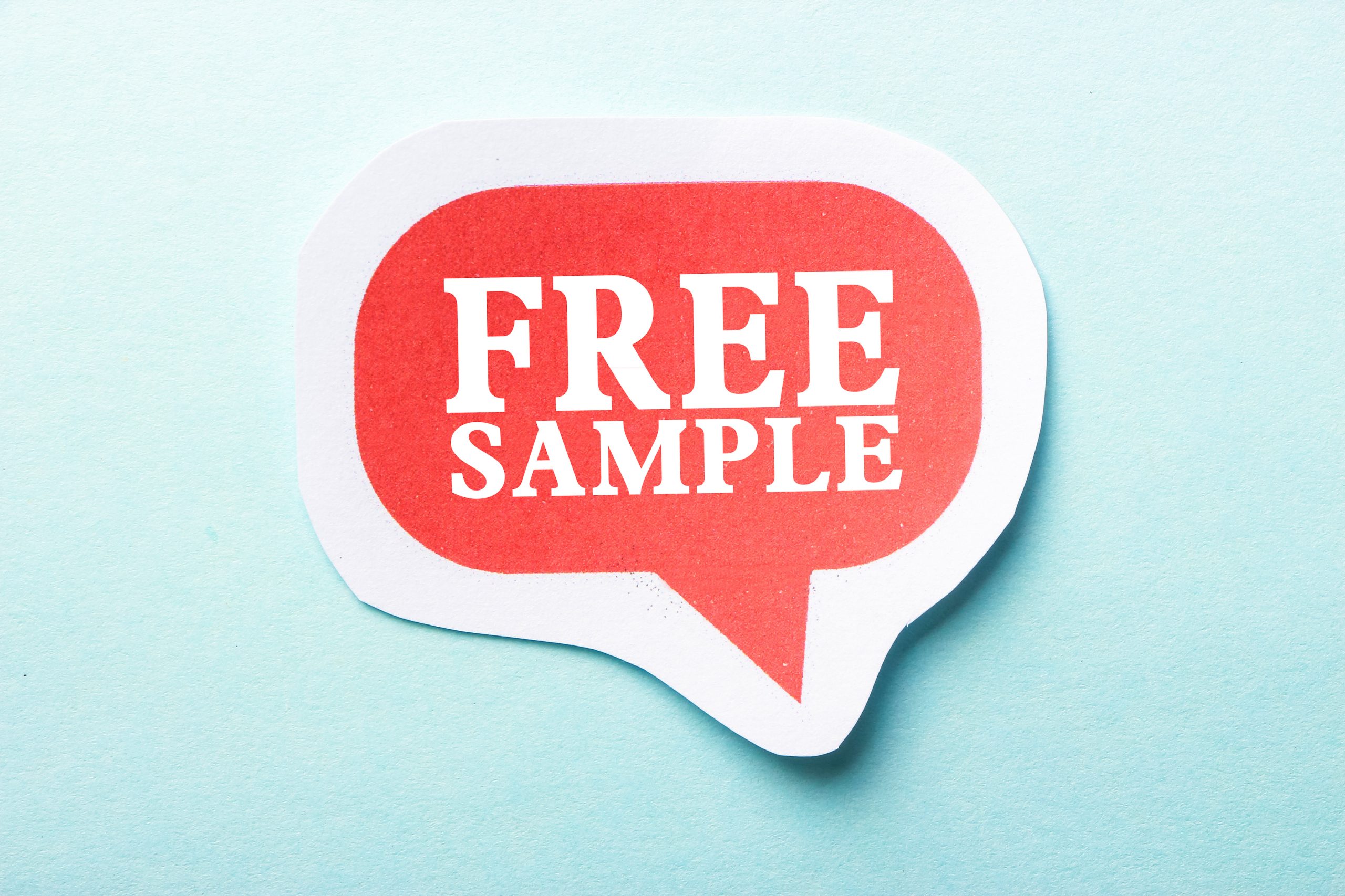Image depicting a soft blue gradient field, in the center of which is a large red word balloon stating, "Free Samples".